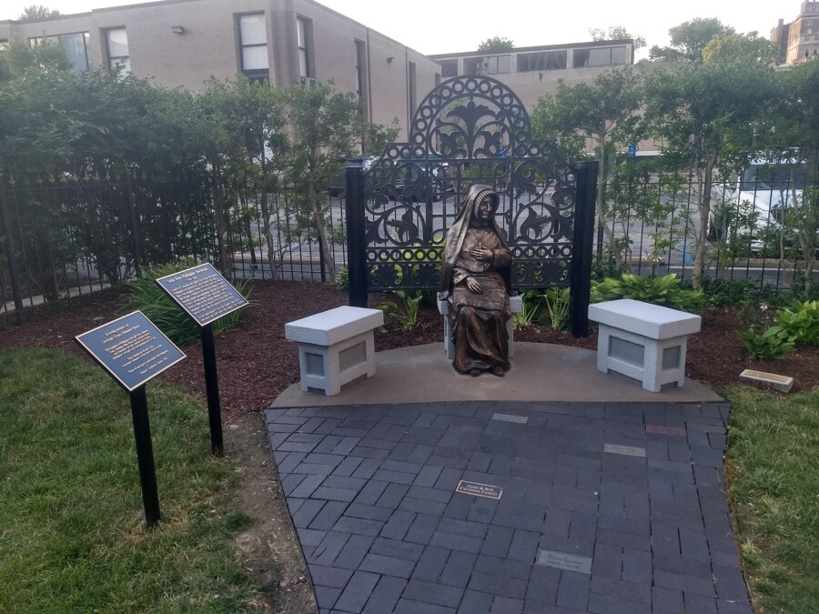 Bronze dedication plaques beside the statue of St. Rose Philippine Duchesne in the Cathedral Basilica garden